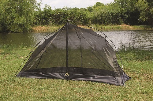 Texsport Camping Backpacking Tent on Grass Next to Water